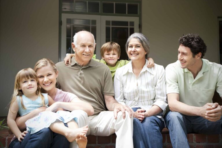 group-picture-of-three-generations-family-sitting-on-the-terrace