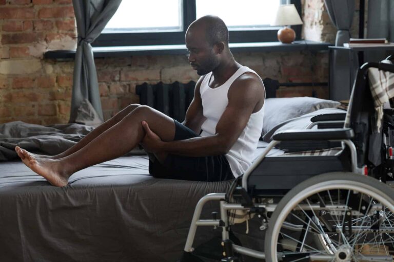man-with-disability-standing-up-from-the-bed.
