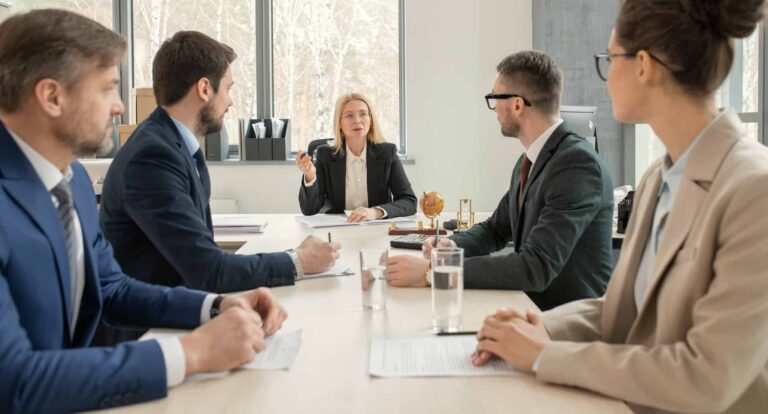 partners-of-law-firm-discussing-agenda-e1666447535340.